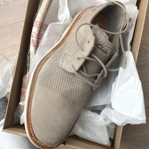 Brand new in box Clark’s dress shoe in a grey color
